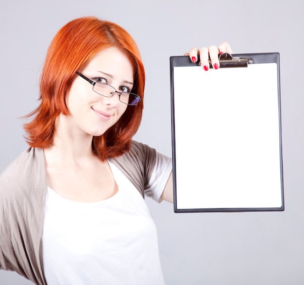 Young businesswoman with white plan board.