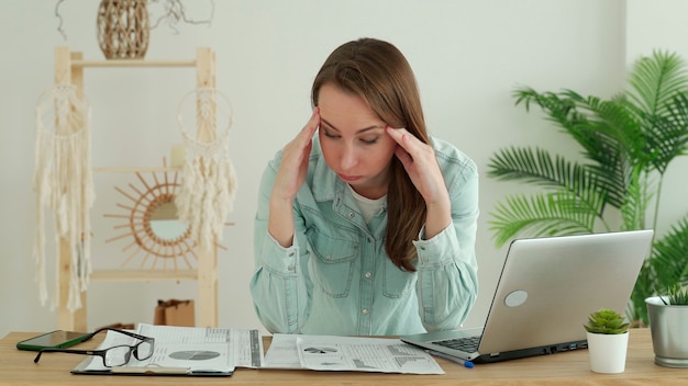 Young businesswoman at work in the office, stressed of work, business problem