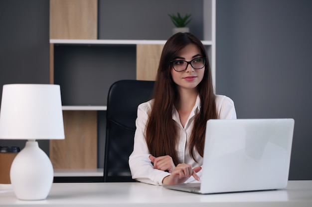 Young businesswoman working at her desk