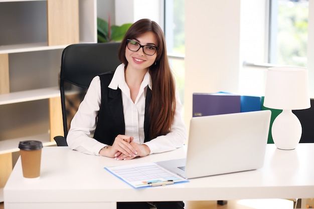 Young businesswoman working at her desk