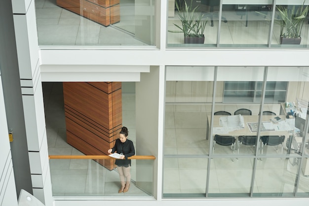 Young businesswoman working at modern office building