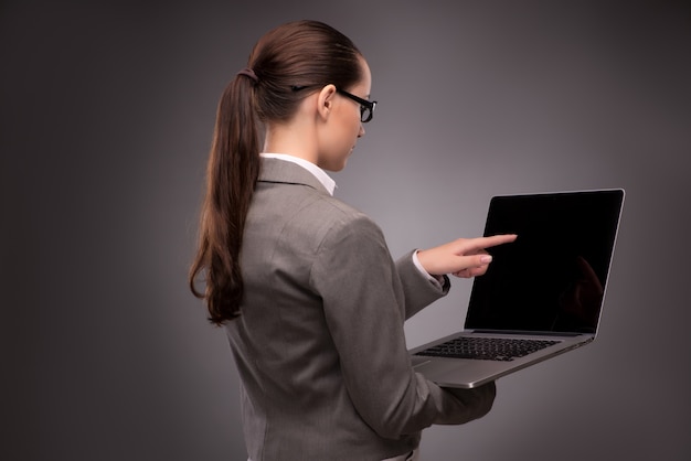 Young businesswoman working with laptop in business concept