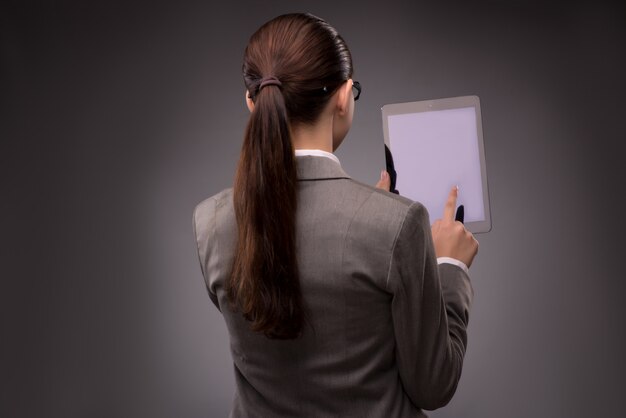 Young businesswoman working with tablet computer