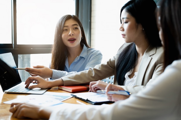 Young businesswomen discuss the charts strategy and financial plan