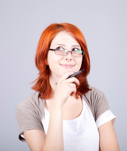 Young businesswomen with pen in hand