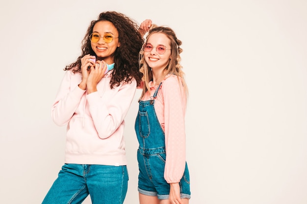 Young carefree women posing in studio