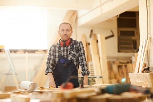 Young carpenter Posing in Workshop