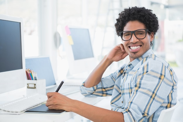 Young casual designer smiling at camera