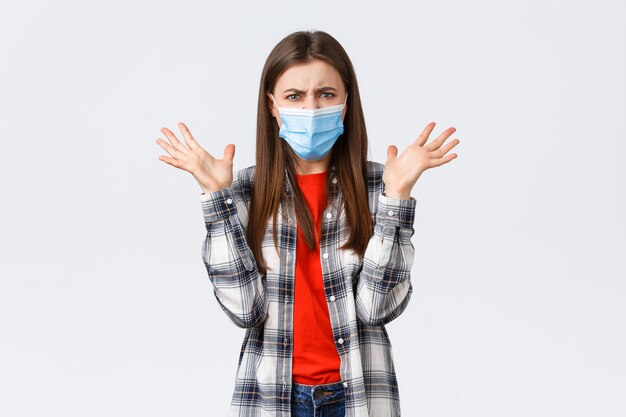 Young casual girl wearing protective mask