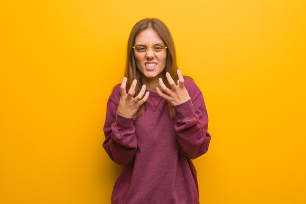 Young casual woman angry and upset