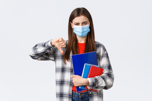 Young casual woman wearing medical mask