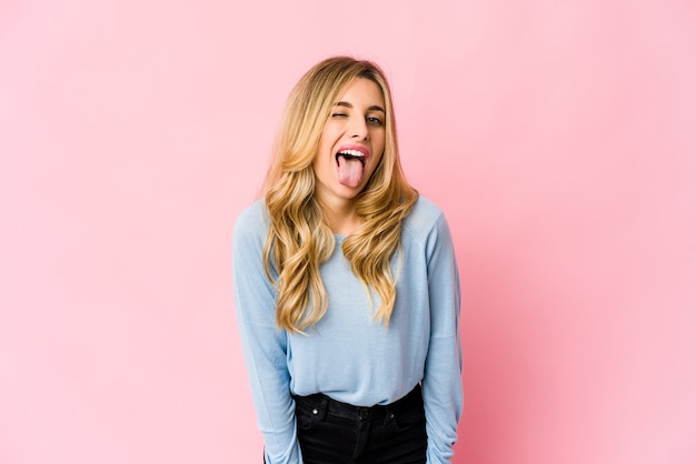 Young caucasian blonde woman happy, smiling and cheerful.