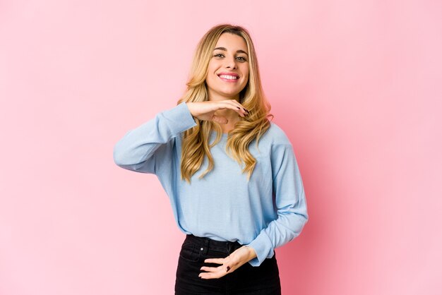 young caucasian blonde woman keeping two arms crossed, denial concept.