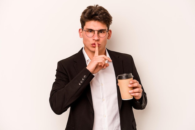 Young caucasian business man holding takeaway coffee isolated on white background keeping a secret or asking for silence