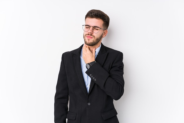 Young caucasian business man posing in a white wall isolated Young caucasian business man suffers pain in throat due a virus or infection.