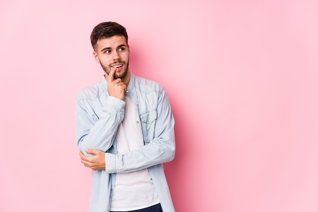 Young caucasian business man posing in white