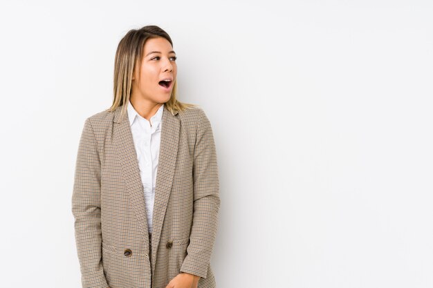 Young caucasian business woman isolated being shocked because of something she has seen.