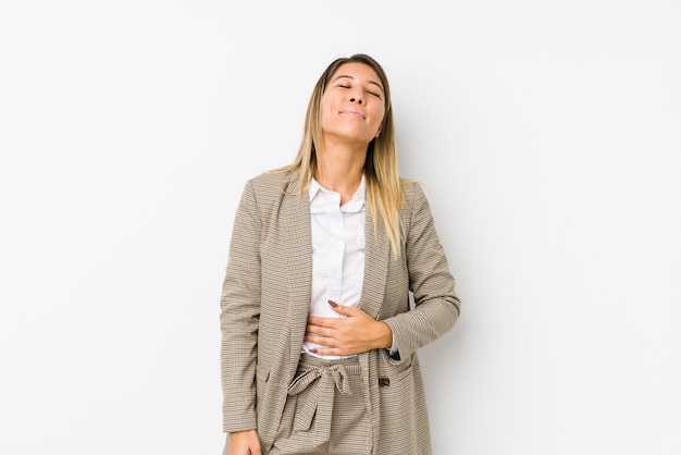 Young caucasian business woman isolated touches tummy