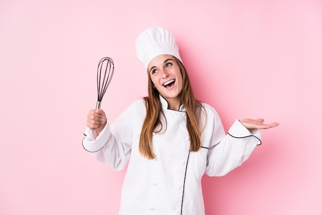 Young caucasian chef woman cooking