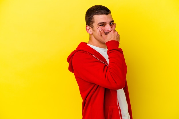 Young caucasian cool man isolated laughing