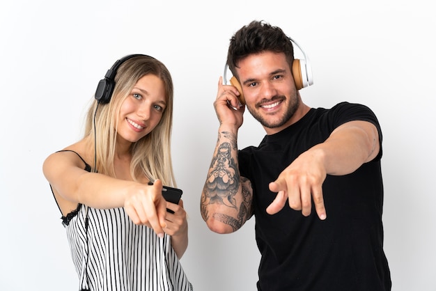 Young caucasian couple listening music