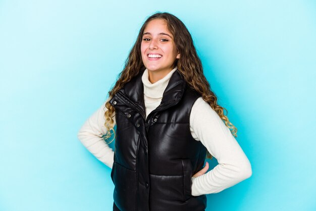 Young caucasian curly hair woman isolated happy, smiling and cheerful.