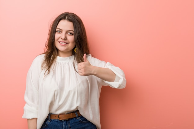 Young caucasian curvy woman standing