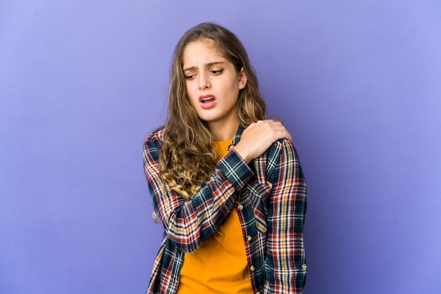 Young caucasian cute woman having a shoulder pain.