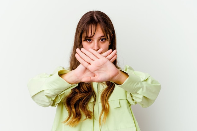 Young caucasian cute woman isolated on white background doing a denial gesture