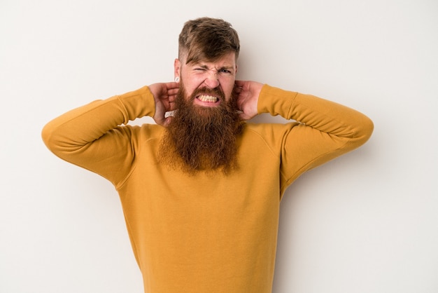 Young caucasian ginger man with long beard isolated on white background touching back of head, thinking and making a choice.