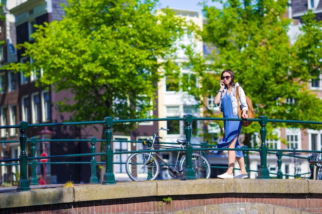 Young caucasian girl enjoy european vacation in Amsterdam, Holland