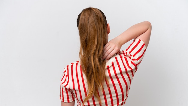 Young caucasian girl isolated on white background in back position and thinking