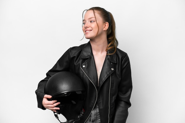 Young caucasian girl with a motorcycle helmet