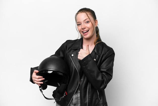 Young caucasian girl with a motorcycle helmet