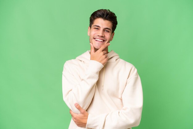 Young caucasian handsome man over isolated background happy and smiling