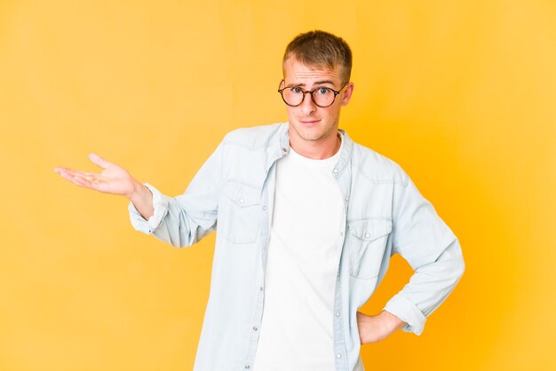 Young caucasian handsome man isolated expressing emotions