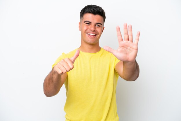 Young caucasian handsome man isolated on white background counting six with fingers