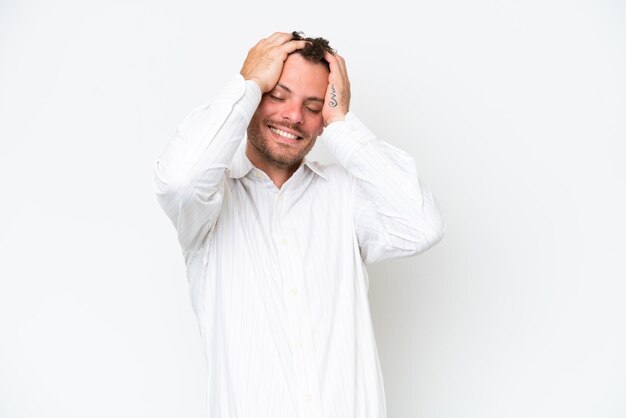 Young caucasian handsome man isolated on white background laughing