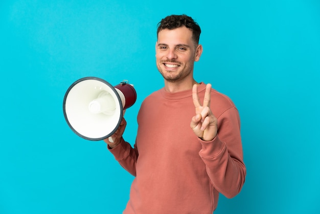 Young caucasian handsome man isolated