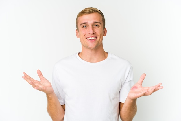 Young caucasian handsome man showing a welcome expression.