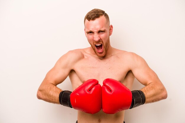 Photo young caucasian man doing boxing isolated on white background