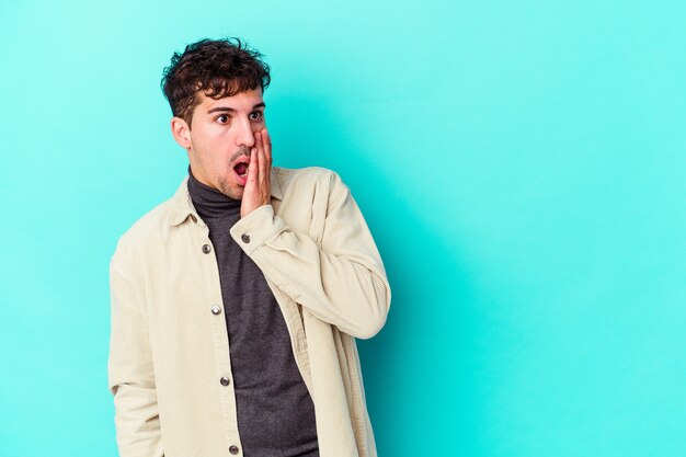 Young caucasian man expressing emotions isolated