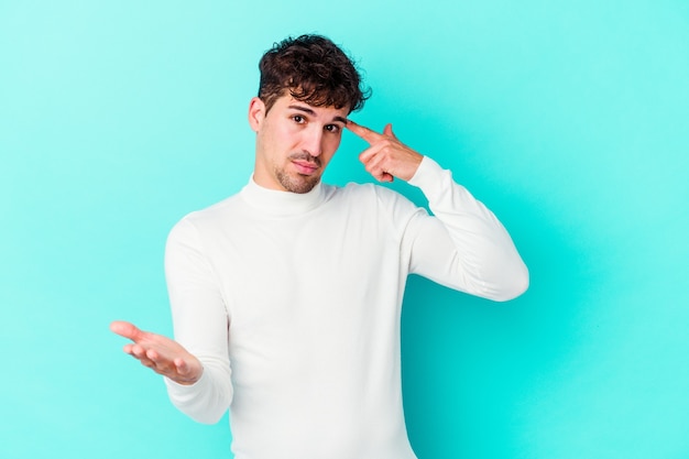 Young caucasian man expressing emotions isolated