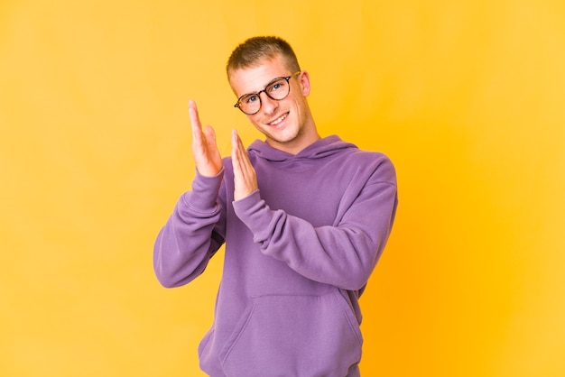 Young caucasian man expressing emotions isolated