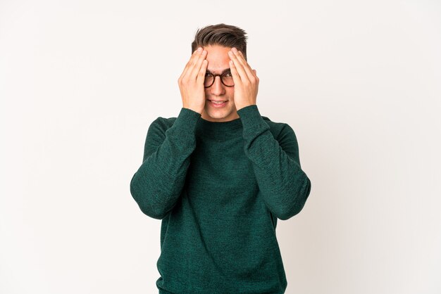 Young caucasian man expressing emotions isolated