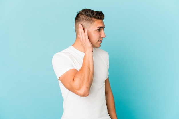 Young caucasian man expressing emotions isolated