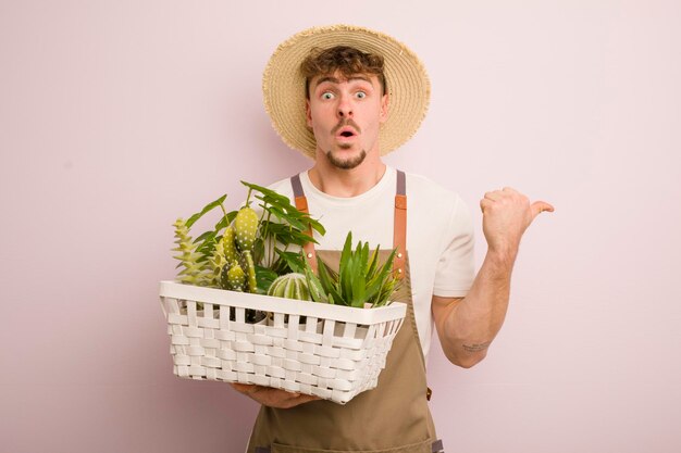 Young caucasian man farmer concept