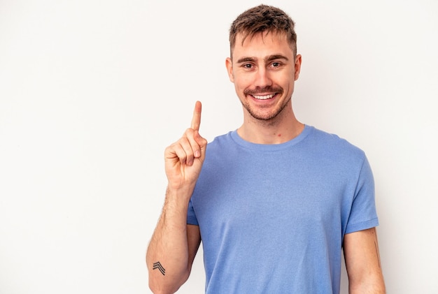 Young caucasian man isolated on pink background biting fingernails, nervous and very anxious.