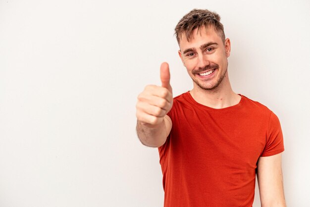 Young caucasian man isolated on white background afraid covering eyes with hands.