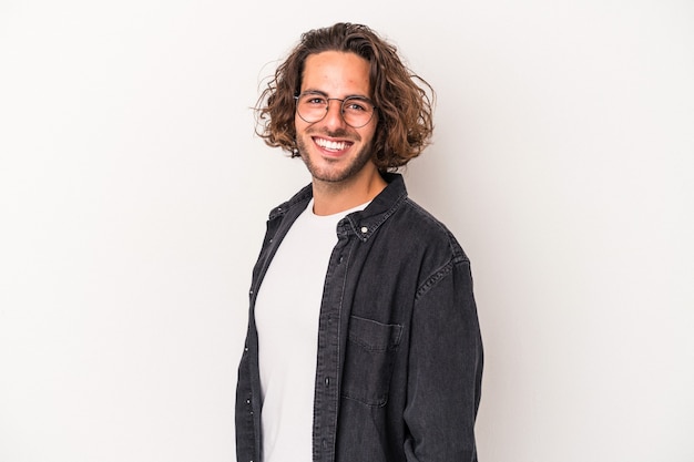 Young caucasian man isolated on white background confident keeping hands on hips.